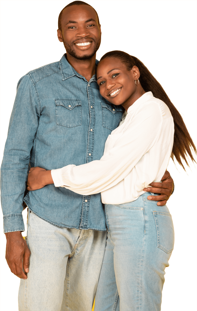 Happy African American Couple Hugging Posing Standing Smiling To Camera On Yellow Studio Background. Happiness In Marriage And Romantic Relationship Concept